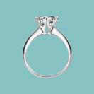 Dainty round moissanite solitaire ring with six claw setting