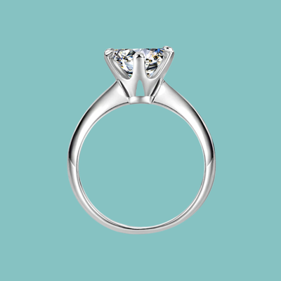 Dainty round moissanite solitaire ring with six claw setting