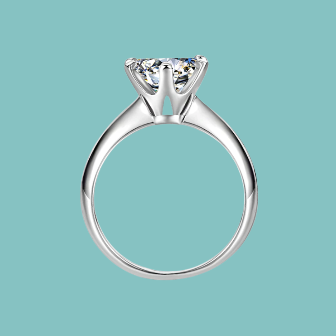 Dainty round moissanite solitaire ring with six claw setting