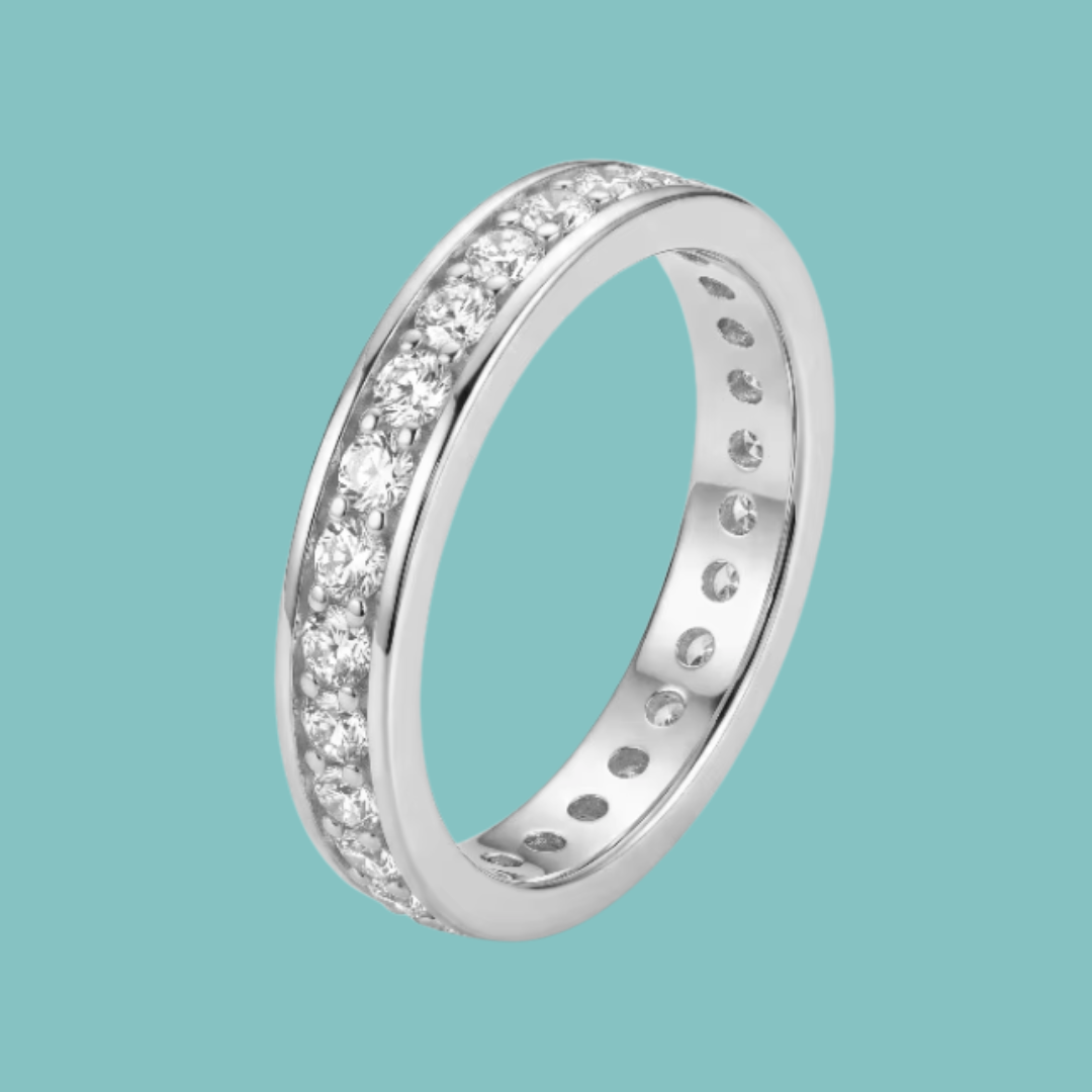Close-up of a sparkling moissanite-style eternity band with polished silver finish