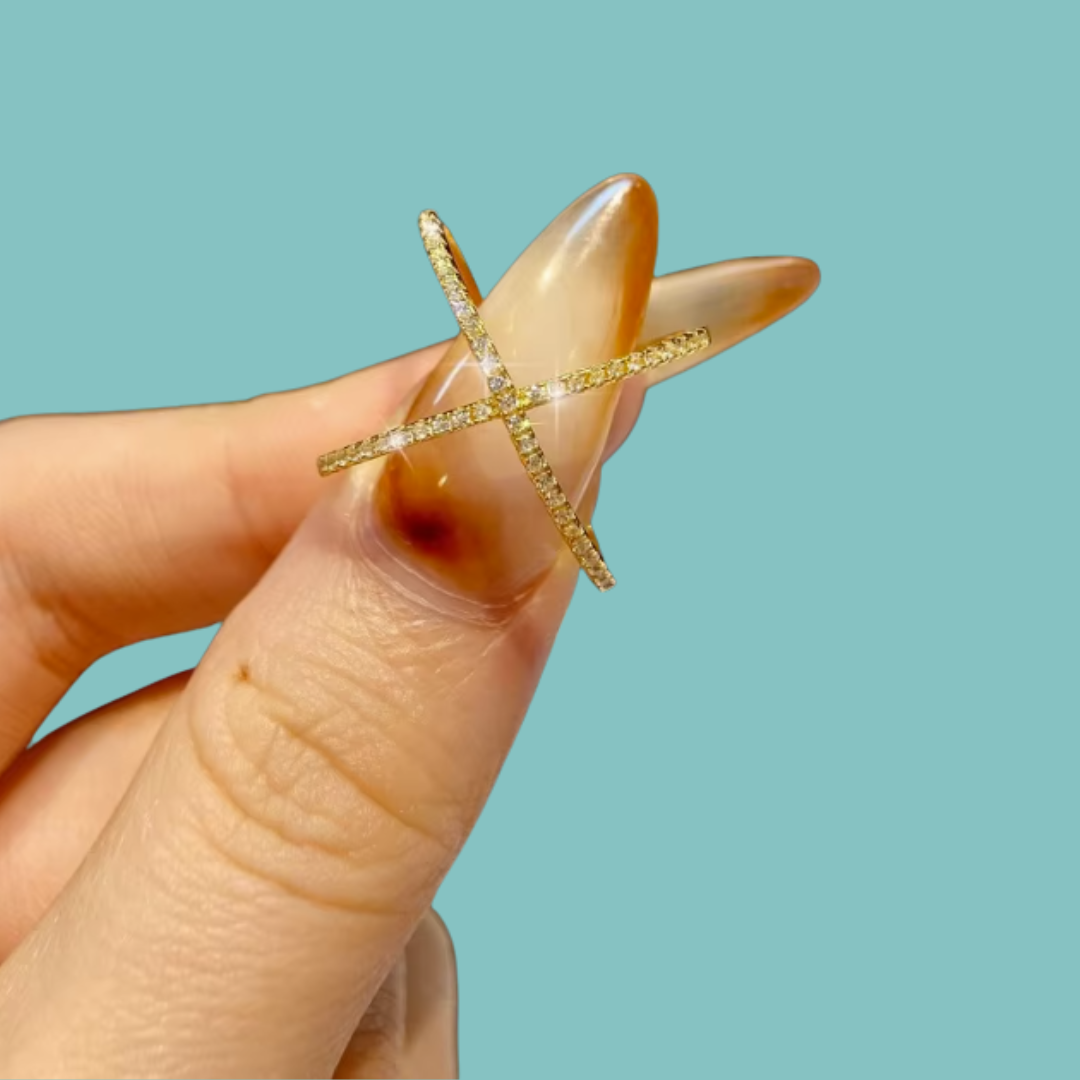 Sparkling gold-tone X-shaped moissanite ring