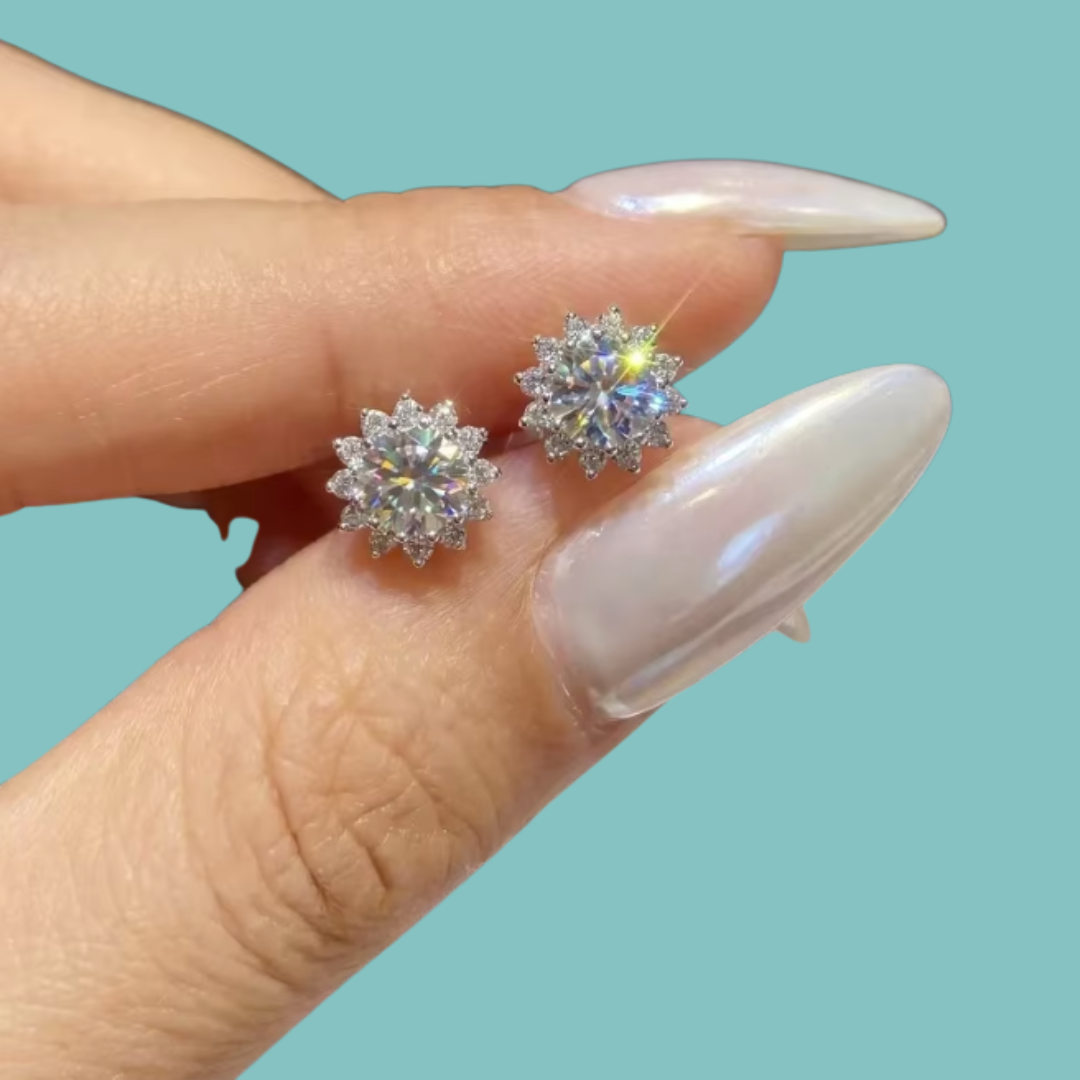 Silver-tone halo moissanite stud earrings displayed on a white background
