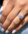 Round moissanite engagement ring set with double pavé wedding bands