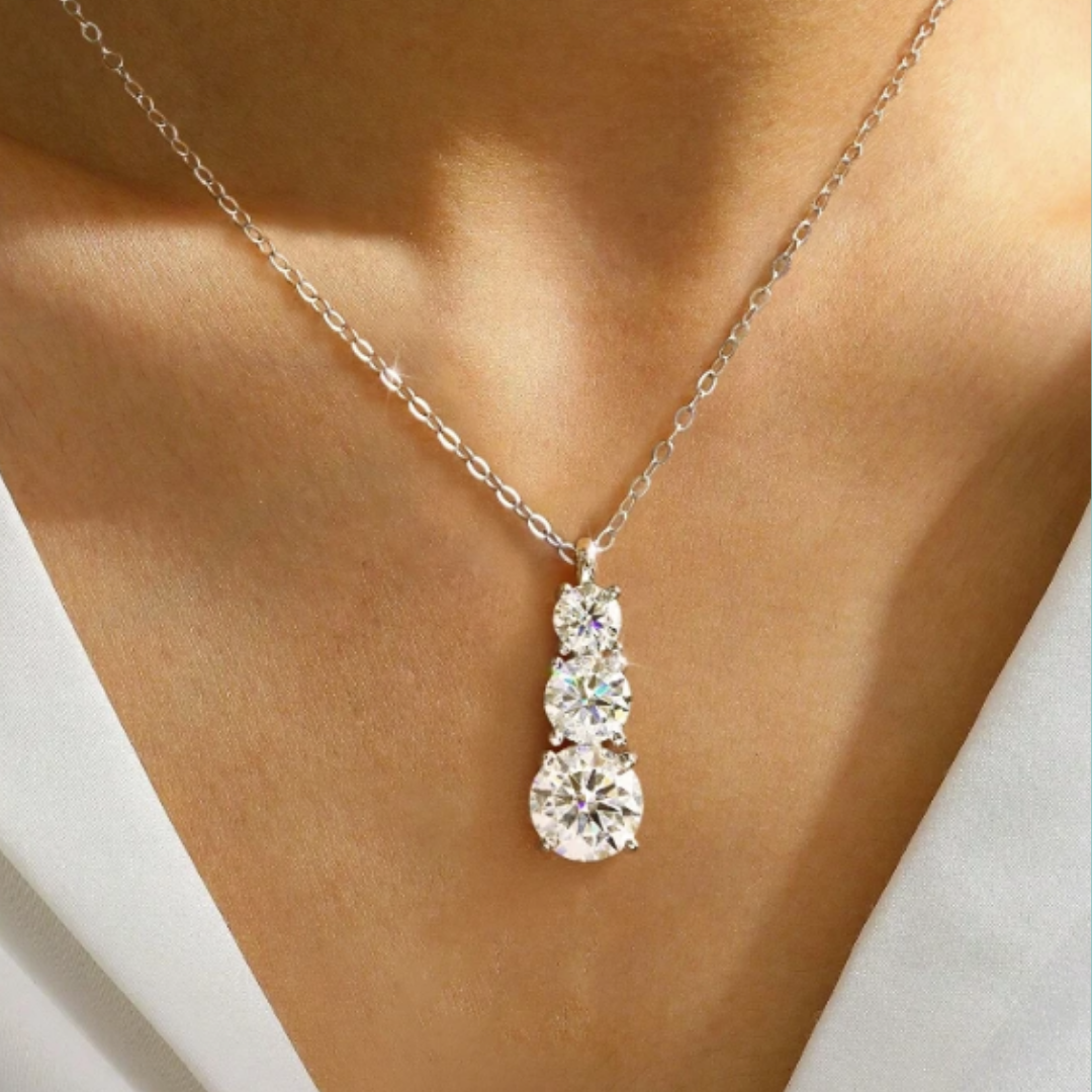 Shop the Nova Necklace, a 1.8ct moissanite gold-filled three-stone necklace with brilliant diamond-like sparkle. Perfect for everyday wear, layering, or gifting.