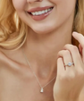1 carat round moissanite engagement-style ring with hidden halo, pavé band and four-prong setting in 14K gold filled.