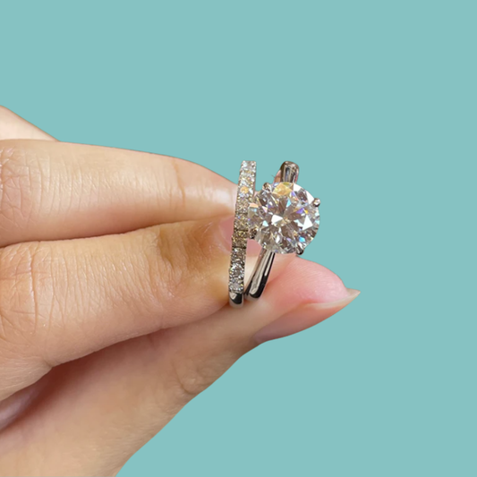 Sparkling moissanite engagement ring and matching band