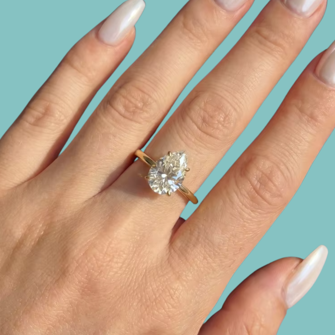Elegant 1 carat pear shaped moissanite engagement style ring in 14k gold filled setting