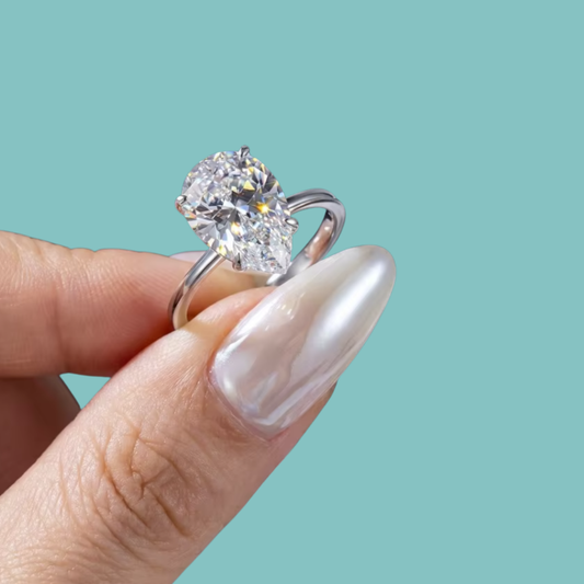 Pear cut moissanite ring with 1 carat centre stone and slim gold filled band