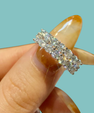 Celina Band with rows of round sparkling stones in an elegant wide band design.