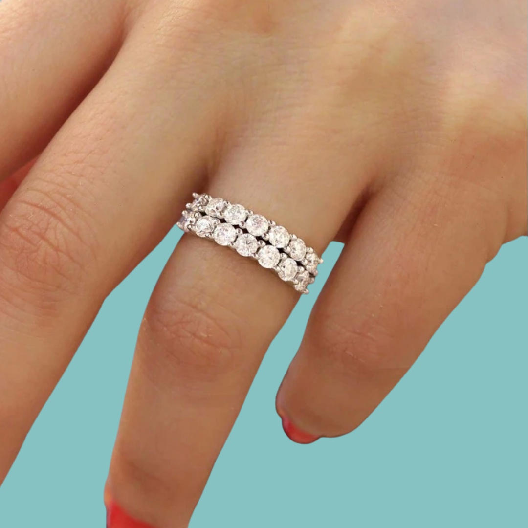 Statement moissanite band featuring multiple rows of round-cut stones on a silver band.