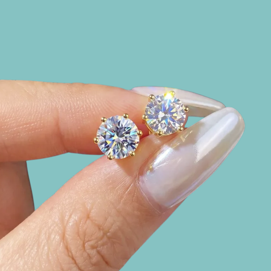 Classic gold-coloured moissanite stud earrings with brilliant round-cut 1 carat stones.