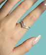 Silver V-shaped contour wedding band with brilliant moissanite stones for stacking