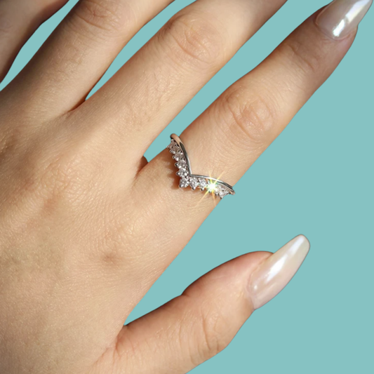 Silver V-shaped contour wedding band with brilliant moissanite stones for stacking