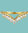 Vela wedding band featuring a delicate chevron design with moissanite sparkle.