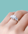 Cushion cut engagement ring with side stones and brilliant centre stone