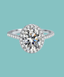 Oval cut moissanite engagement ring with sparkling halo setting