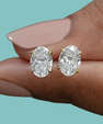 Elegant oval cut moissanite earrings in sterling silver setting
