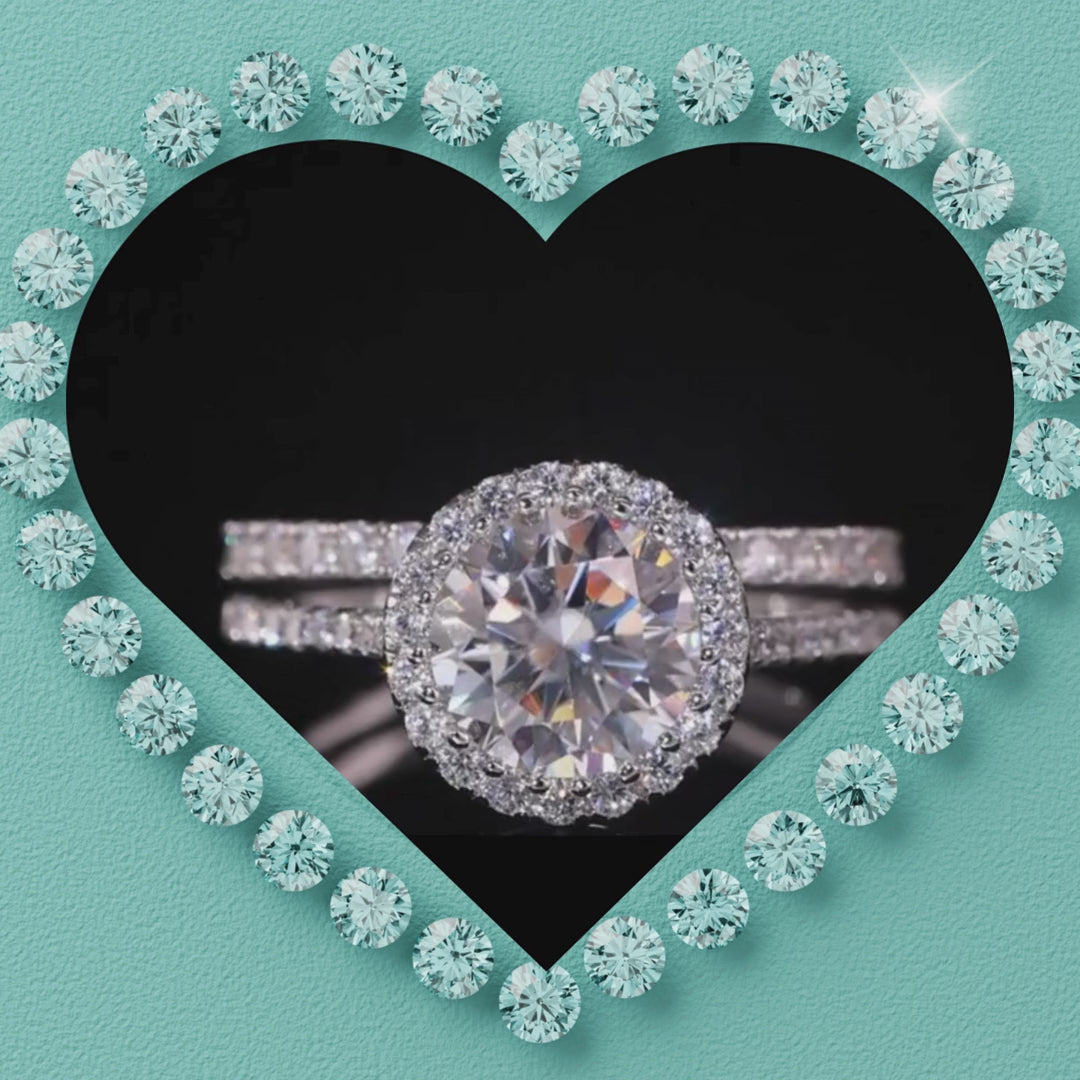 Round moissanite halo ring set in sterling silver with pavé band