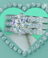 Round cut moissanite bridal ring set with matching pavé bands in sterling silver