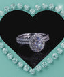 Oval cut moissanite halo engagement ring set with matching band