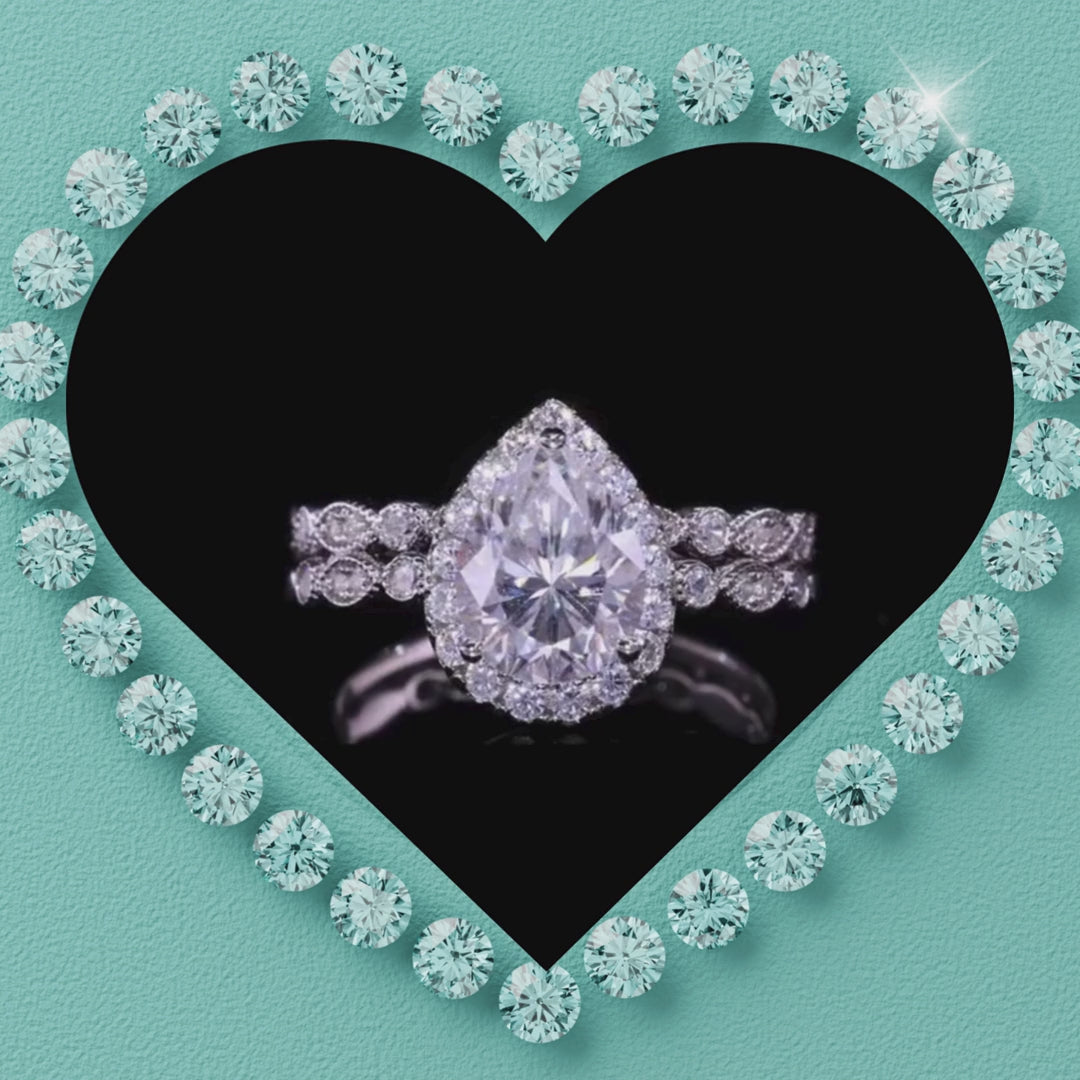Pear moissanite ring set with teardrop centre stone and matching wedding band