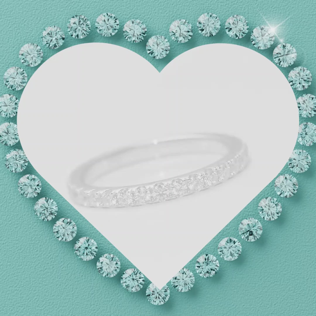 Elegant shared-prong moissanite wedding band with brilliant round stones