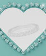 Elegant shared-prong moissanite wedding band with brilliant round stones