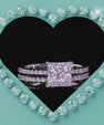 Sparkling vide of a princess cut moissanite ring set with a brilliant faceted centre stone and delicate matching band.