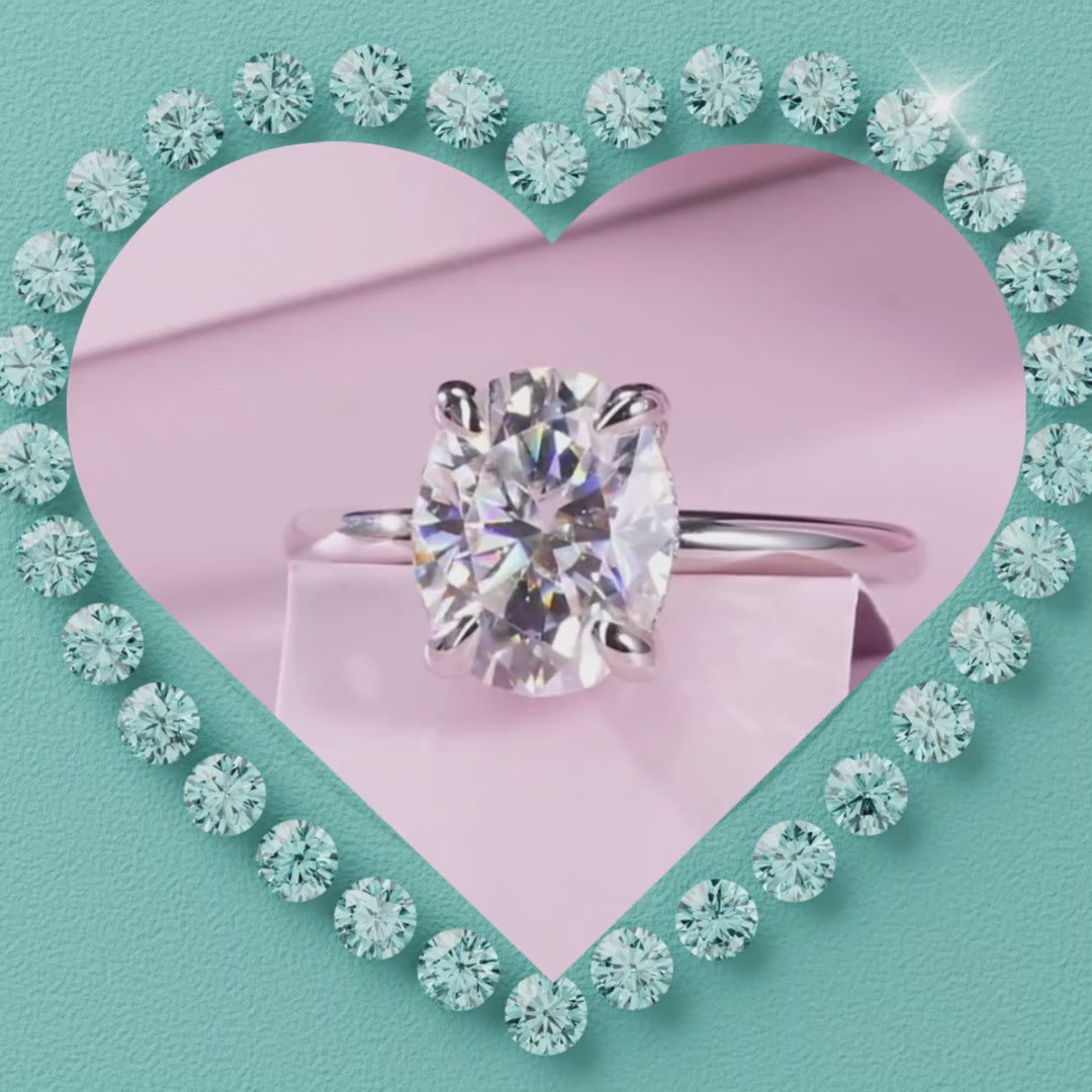 Matching oval moissanite ring set with hidden halo design