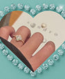 Amara 14k gold-filled ring with a floral-inspired sparkling cluster and stone-set band.