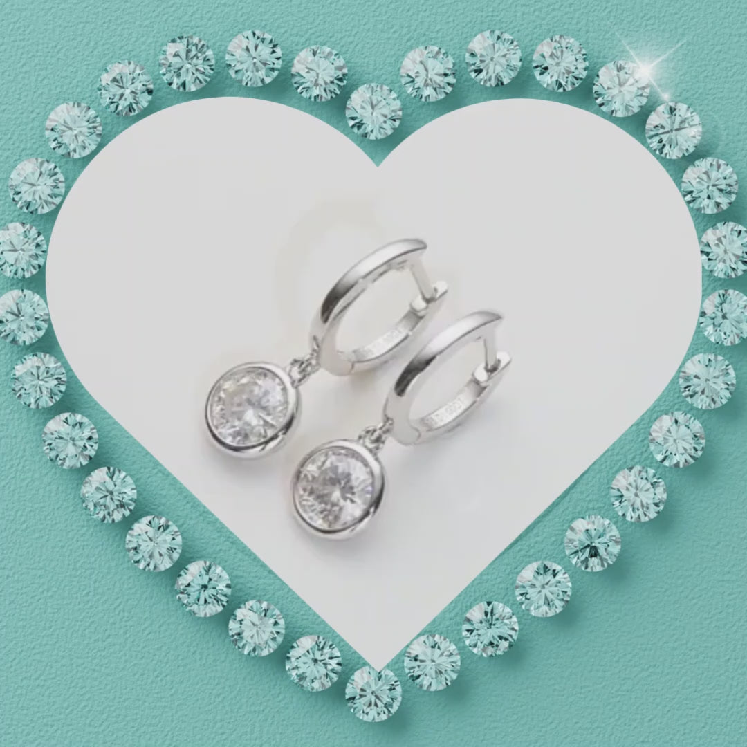 Elegant bezel set drop earrings with sparkling moissanite stones