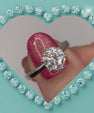 Timeless round moissanite solitaire ring with polished silver tone band
