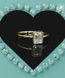 Modern emerald cut bezel set moissanite ring for women