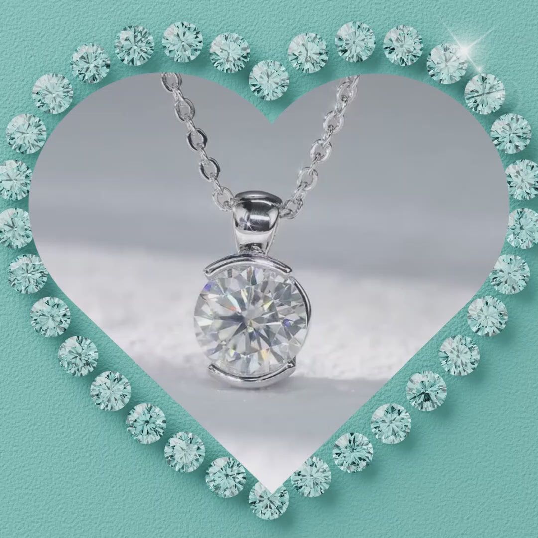 Close-up of a brilliant solitaire moissanite necklace with a polished setting