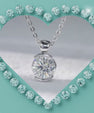 Close-up of a brilliant solitaire moissanite necklace with a polished setting